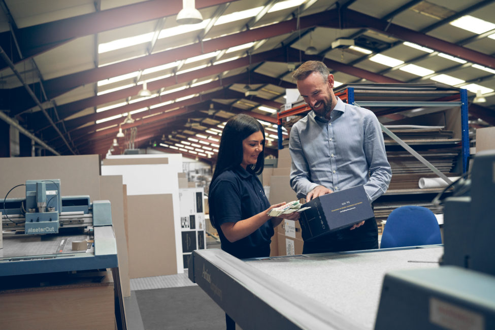 McLaren Packaging staff reviewing the packaging manufacturing